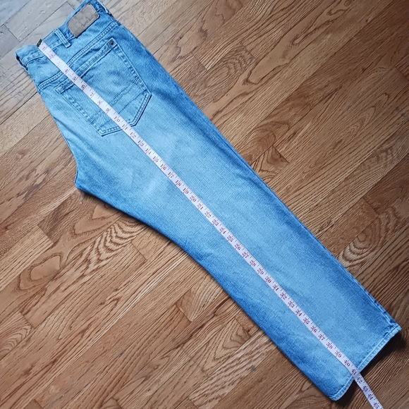 Calvin Klein • Men's Light/Medium Wash Distressed Bootcut Denim Jeans - Picture 11 of 15